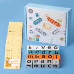 word spelling game with cards and wooden letter blocks
